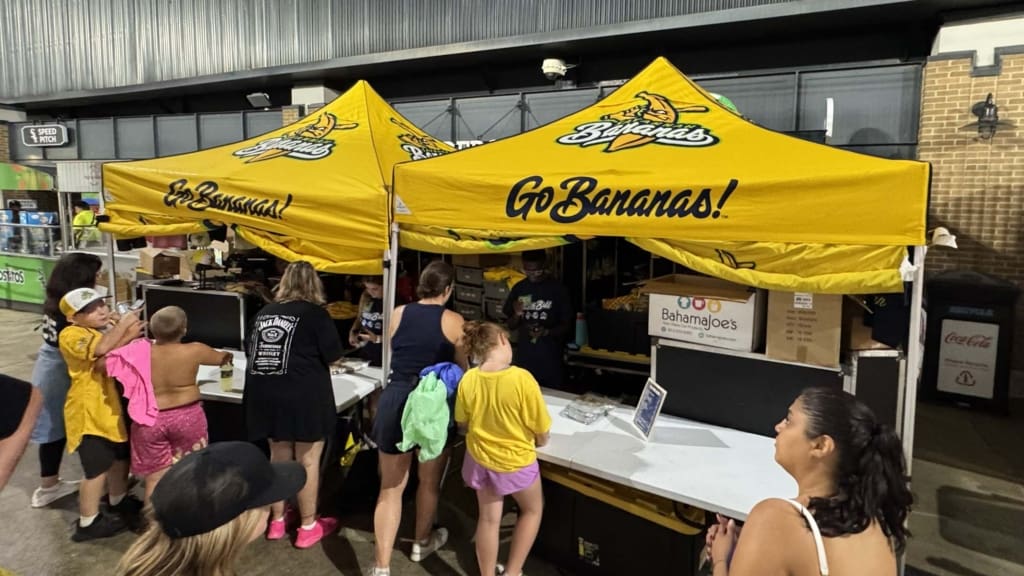 Fans at a Banana Ball merchandise tent